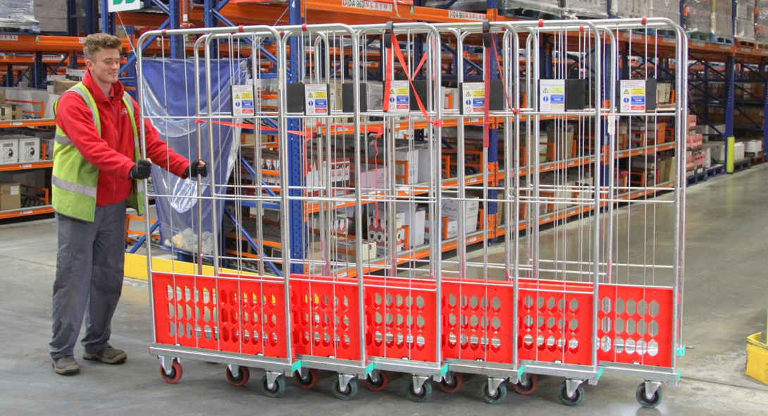 A man pushing industrial trolleys with bolt hole castors